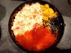 Bowl of rice topped with sashimi.jpeg